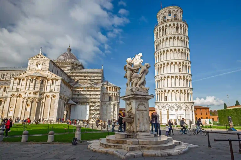 Pisa Baptistery: A marvel of medieval architecture in Piazza dei Miracoli, Italy, known for its exquisite design and acoustics, adjacent to the iconic Leaning Tower.